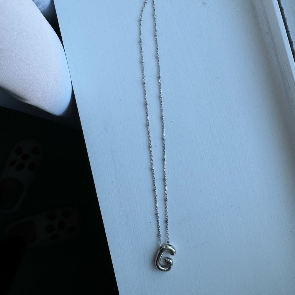 Silver bubble G necklace